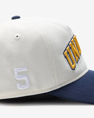 UNDEFEATED 2-TONE ARCH SNAPBACK - IVORY/ NAVY