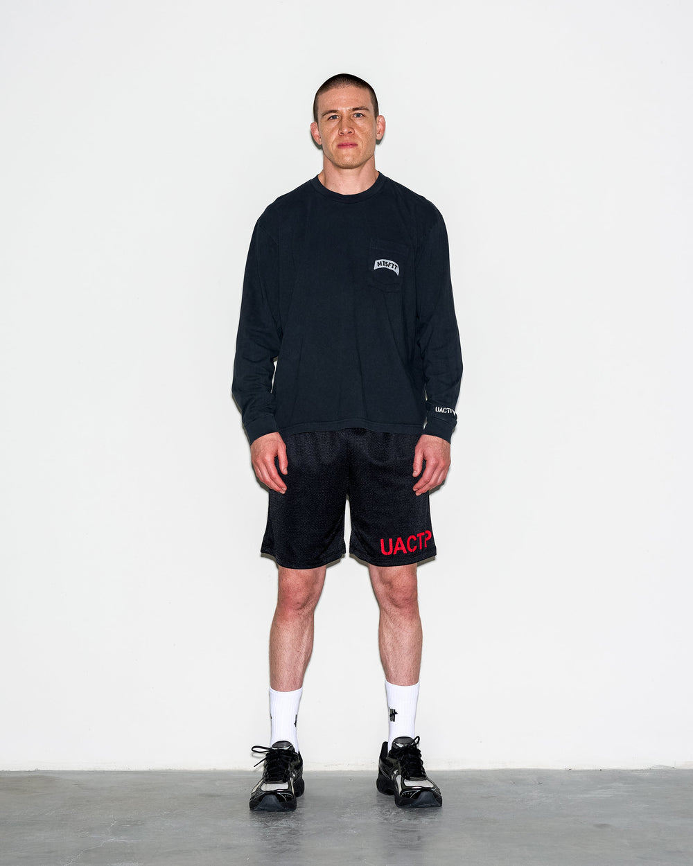 UACTP X GARDAR EIDE EINARSSON STENCIL MESH SHORT - BLACK