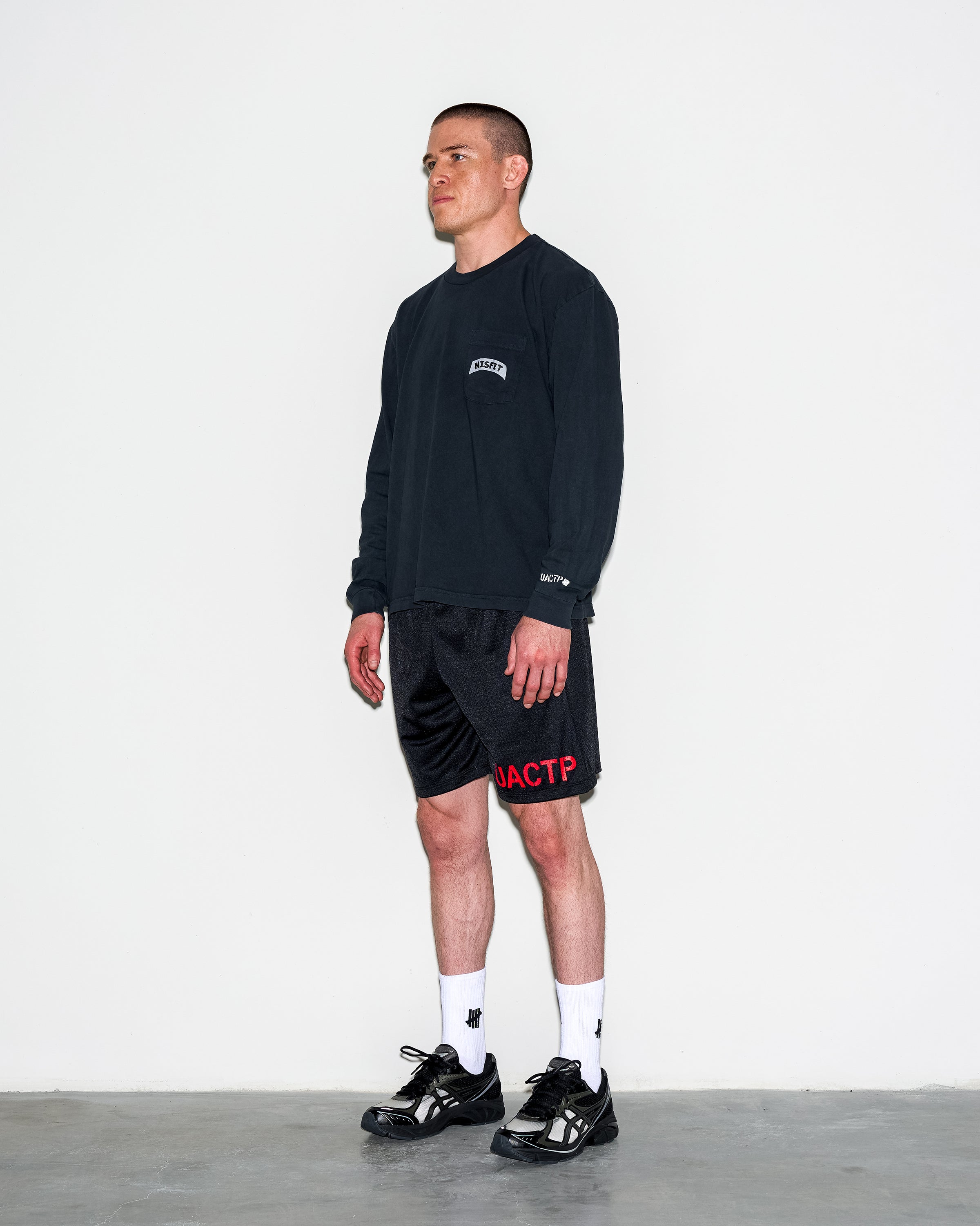 UACTP X GARDAR EIDE EINARSSON STENCIL MESH SHORT - BLACK