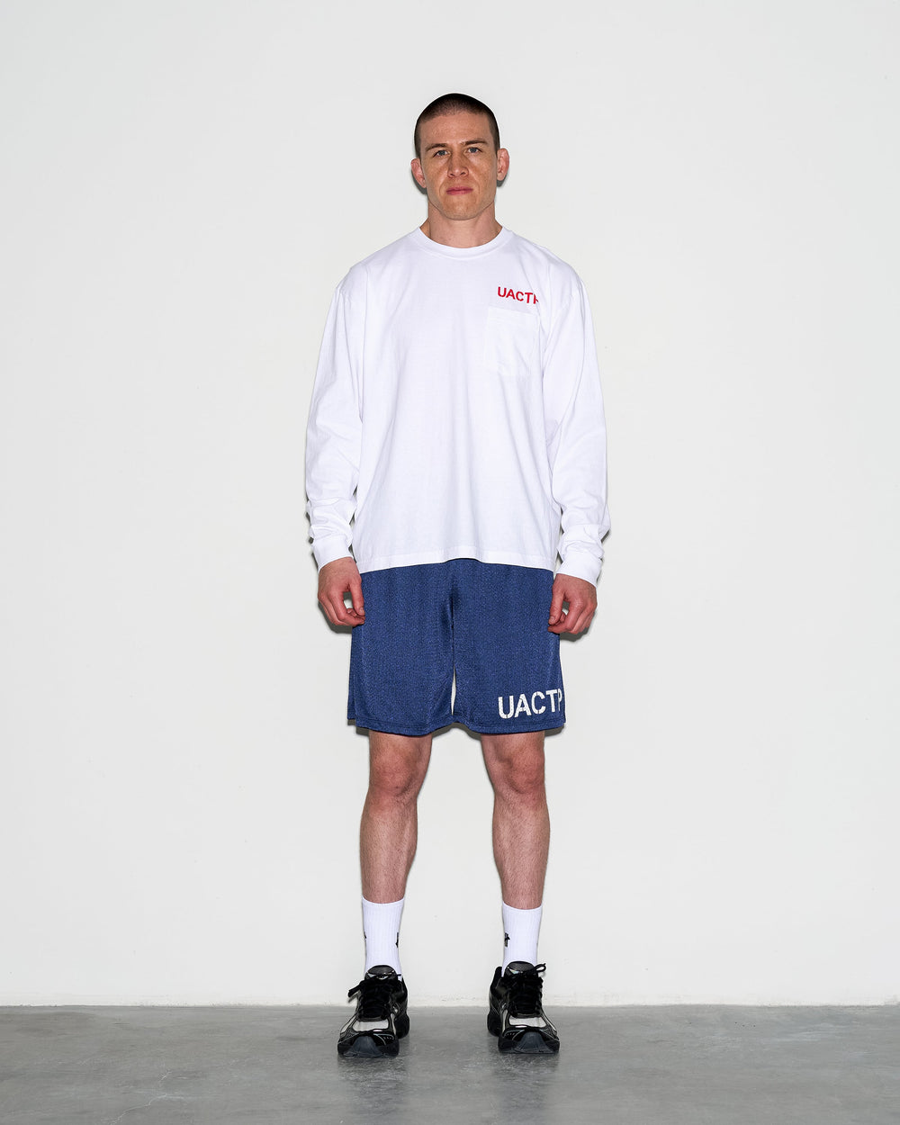 UACTP X GARDAR EIDE EINARSSON STENCIL L/S POCKET TEE - BLACK