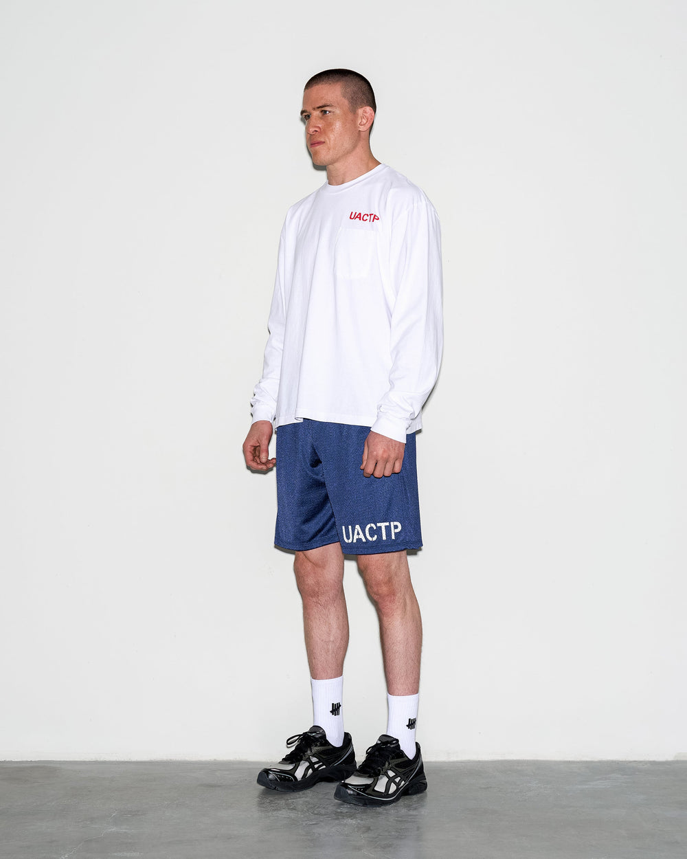 UACTP X GARDAR EIDE EINARSSON STENCIL L/S POCKET TEE - BLACK