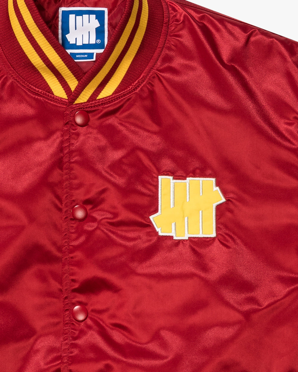 UNDEFEATED ICON SATIN VARSITY JACKET - SCARLET -