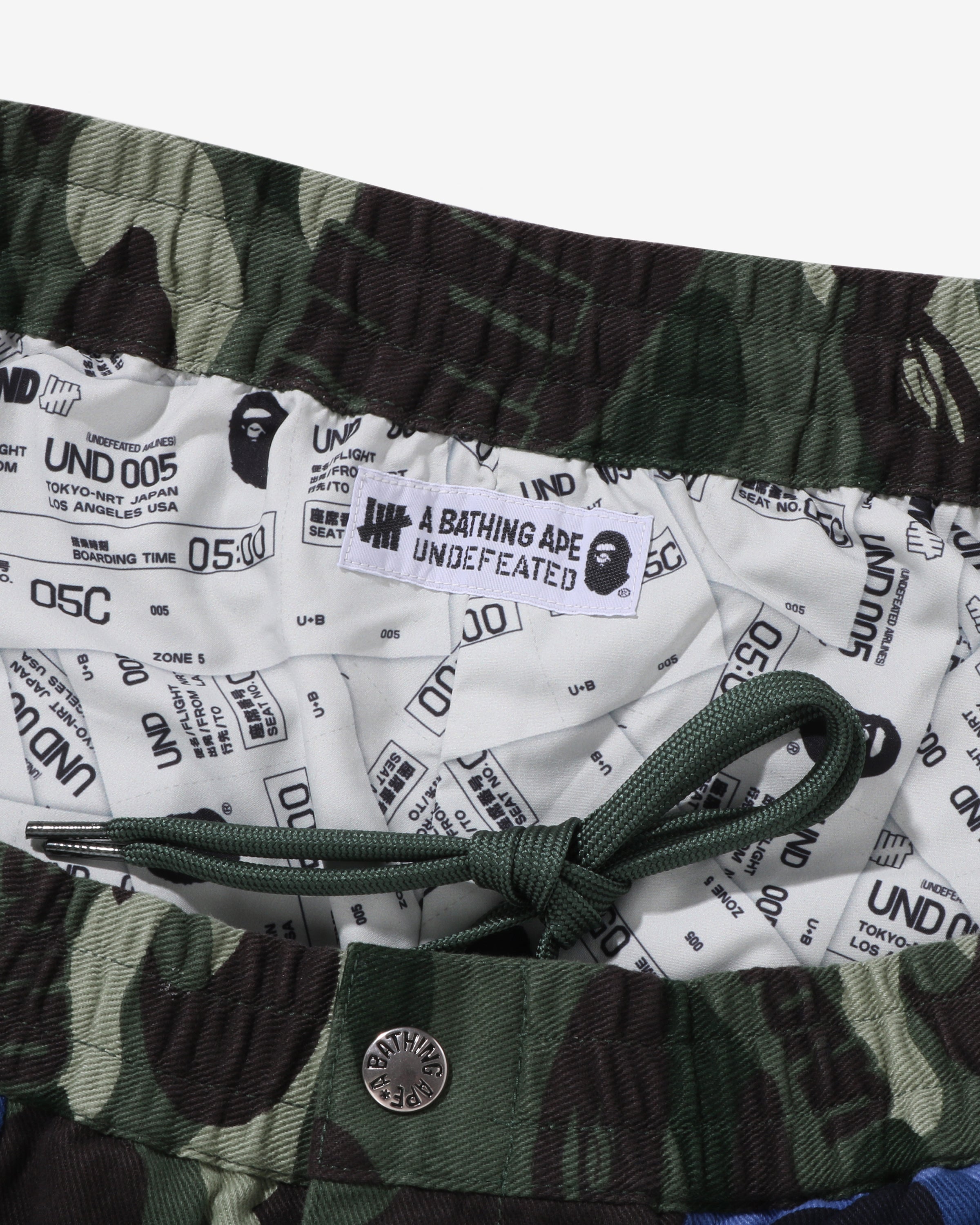 BAPE X UNDEFEATED COLOR CAMO FLANNEL PANTS - GREEN