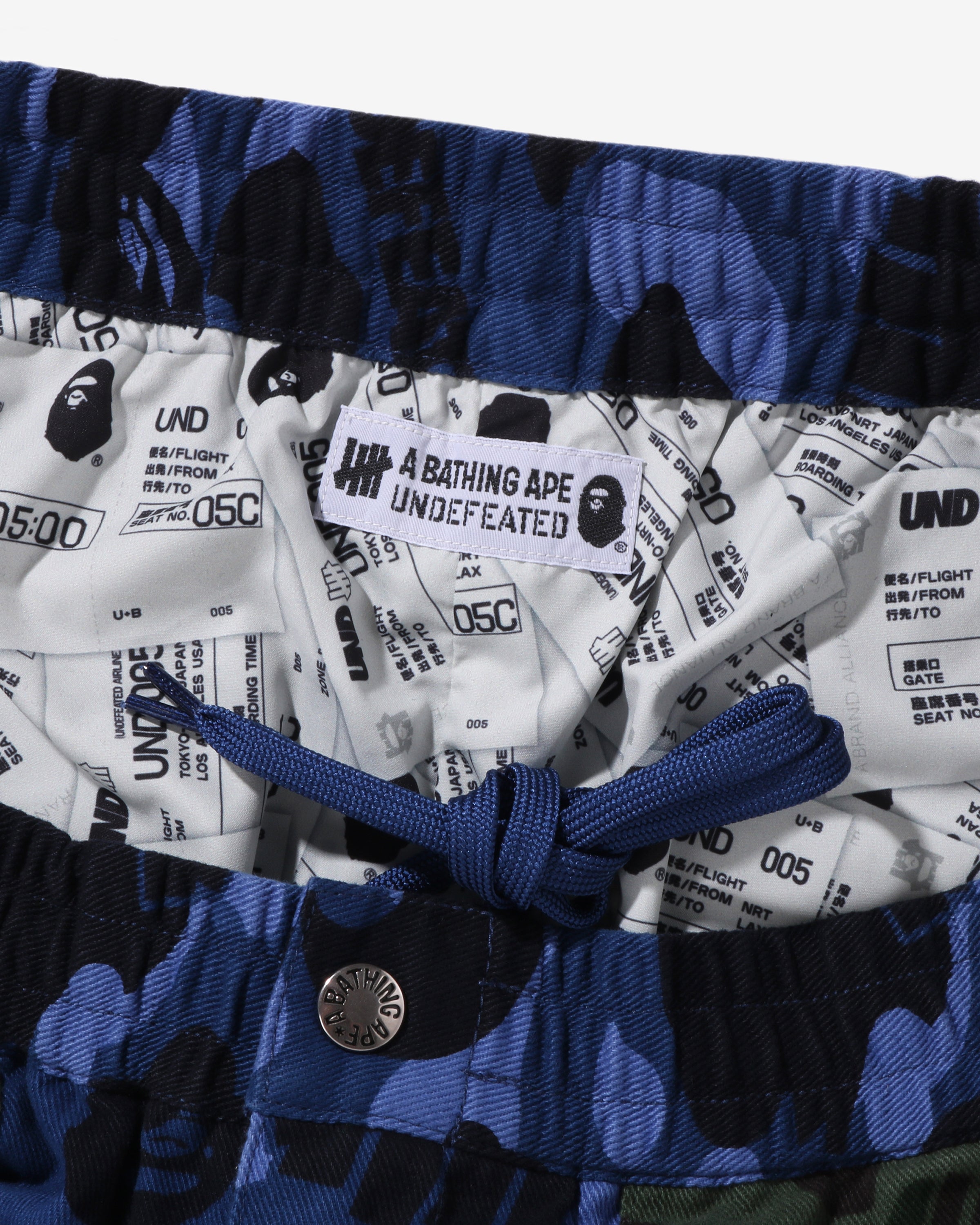 BAPE X UNDEFEATED COLOR CAMO FLANNEL PANTS - NAVY