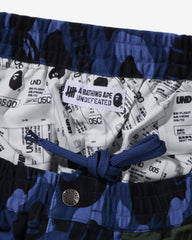 BAPE X UNDEFEATED COLOR CAMO FLANNEL PANTS - NAVY