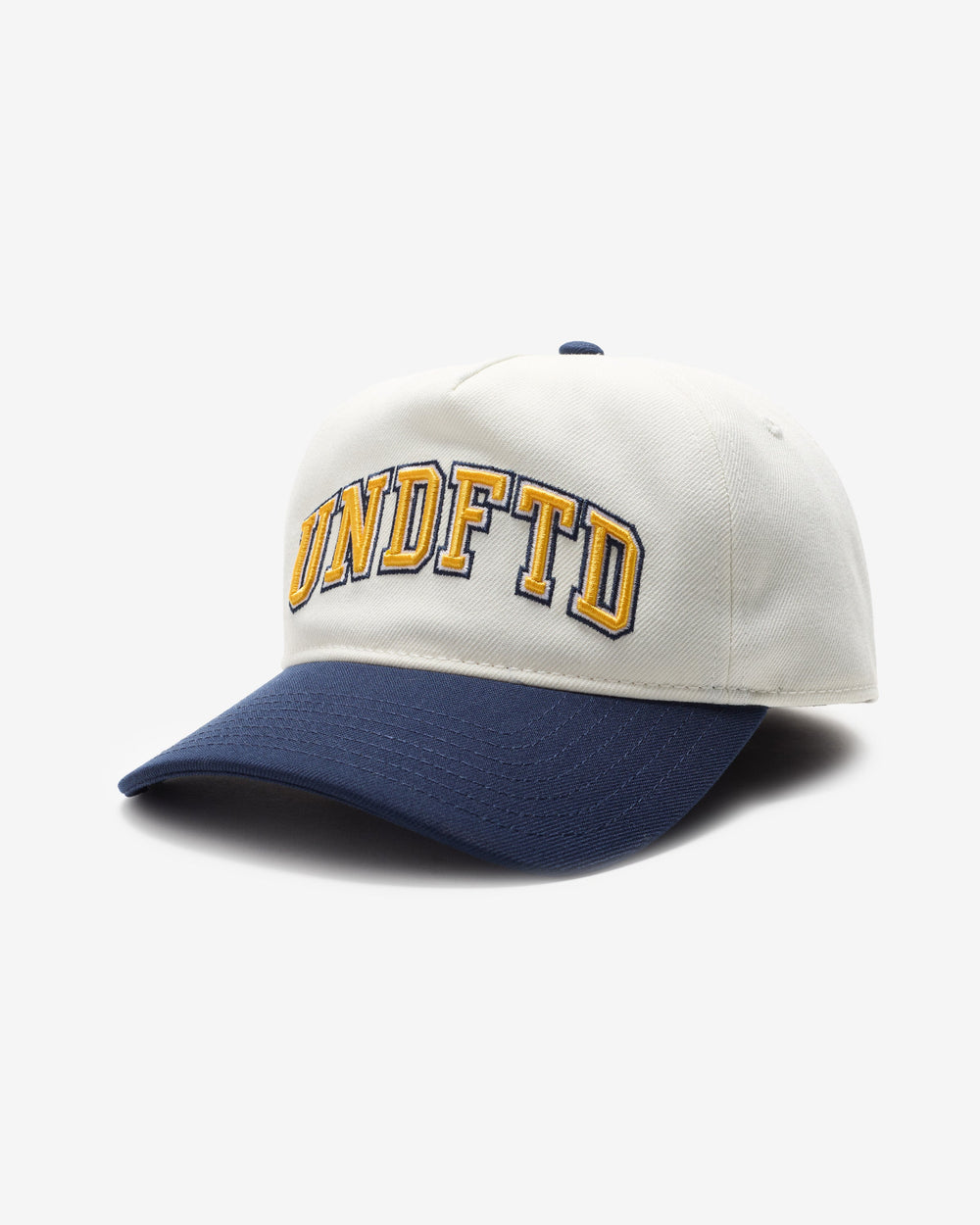 UNDEFEATED 2-TONE ARCH SNAPBACK - IVORY/ NAVY