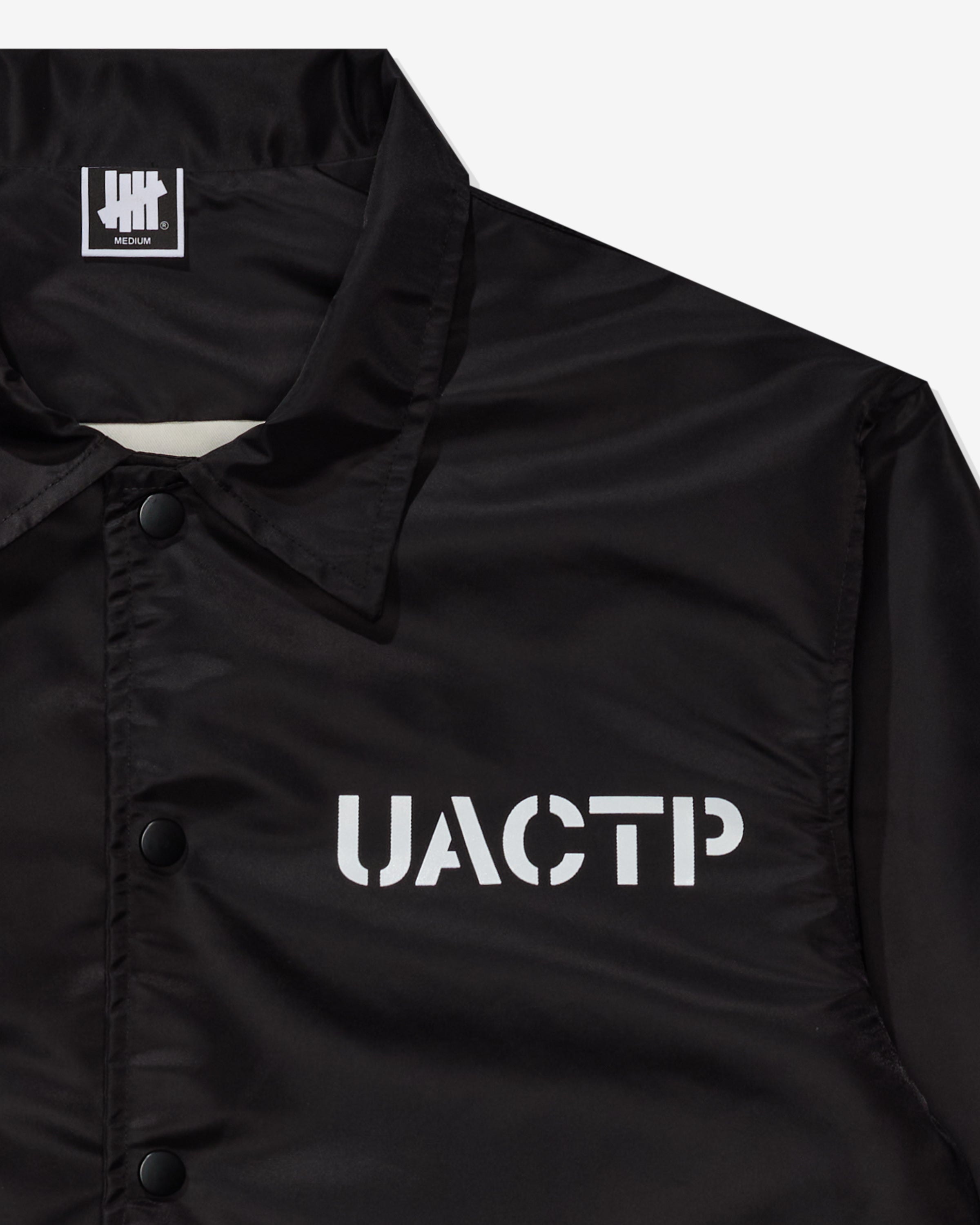 UACTP STENCIL COACHES JACKET - BLACK