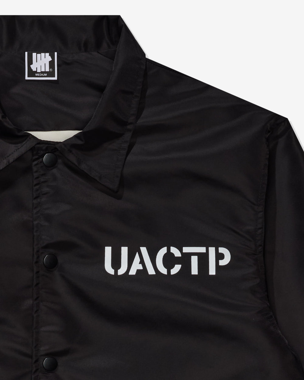 UACTP STENCIL COACHES JACKET - BLACK